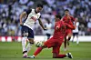 Tottenham Hotspur's Son Heung-min Son, left, and Bayern Munich's Jamal Musiala challenge for the ball during a friendly at Tottenham Hotspur Stadium in London on Saturday. [AP/YONHAP]