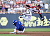 An Chi-hong of the Hanwha Eagles, left, slides into second base under LG Twins shortstop Oh Ji-hwan during the clubs' Korea Baseball Organization regular-season game at Jamsil Baseball Stadium in Seoul on Aug. 10. [YONHAP]