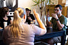 People attending a weekly meet up called ″Sign Squad″ communicate in American Sign Language at the Woodstock Cafe on June 10, 2025, in Portland, Ore. [AP/YONHAP