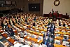 Lawmakers leave the main chamber of the National Assembly after National Assembly Speaker Woo Won-shik declared that the vote on the impeachment motion against President Yoon Suk Yeol would not be held due to insufficient quorum at the plenary session on Dec. 7. [YONHAP]