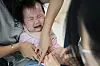A baby receives an influenza immunization shot at a pediatric clinic in northern Seoul in October 2024. [YONHAP]