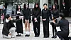 Girl group NewJeans members talk to reporters at the Seoul Central District Court in Seocho District, southern Seoul, on March 7. [YONHAP]