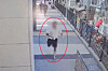 A fugitive wanted for violent crimes throws off his slippers and runs from an identification check by police in Busan on Sept. 4. [BUSAN METROPOLITAN POLICE]