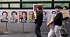 Public officials on May 30 move boxes filled with ballots cast during the presidential election's early voting period in Seoul. [YONHAP]
