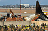 Officials from a joint investigation team retrieve an engine buried at the Jeju Air crash site at Muan International Airport in South Jeolla on Jan. 2, 2025. [YONHAP]