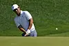 Tom Kim chips up on the 15th hole during the first round of the Travelers Championship golf tournament at TPC River Highlands, in Cromwell, Connecticut on Thursday. [AP/YONHAP]