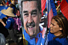 A demonstrator holds a picture of ousted Venezuela's President Nicolas Maduro during a rally to support him and his wife Cilia Flores in Caracas, Venezuela, on Jan. 6. [AFP/YONHAP]
