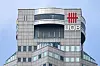 A United Overseas Bank (UOB) company signage is seen on a building facade at the central business district in Singapore on March 14. [AFP]