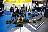 Visitors stand near miniatures of Turkish combat helicopter Kara Kutvvetleri during the Indo Defense 2025 Expo & Forum in Jakarta, Indonesia on June 12. [EPA/YONHAP]