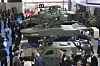 Visitors walks past armoured vehicles displayed at the Indo Defense 2025 Expo & Forum, a biannual arms and defense technology exhibition, in Jakarta, Indonesia, on June 11. [AP/YONHAP]