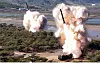 North Korea's 600-millimeter multiple rocket launchers are seen during a drill on May 8. [YONHAP]