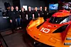 Members of the Genesis Magma Racing team pose in front of the GMR-001 hypercar at the Genesis booth during the 24 Hours of Le Mans endurance race in France on June 13. [HYUNDAI MOTOR GROUP]