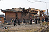 Investigators examine the site of an accidental fighter jet bombing of a village in Pocheon, Gyeonggi, in this file photo taken March 7, one day after the Air Force's two KF-16 fighter jets mistakenly released eight MK-82 air-to-surface bombs outside a training range. [YONHAP]
