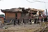 Investigators examine the site of an accidental fighter jet bombing of a village in Pocheon, Gyeonggi, in this file photo taken March 7, one day after the Air Force's two KF-16 fighter jets mistakenly released eight MK-82 air-to-surface bombs outside a training range. [YONHAP]