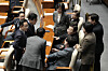 Democratic Party leader Lee Jae-myung, third from right, talks with party members during the plenary session at the National Assembly in Yeouido, western Seoul, on Dec. 26. [AP/YONHAP]