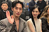 Karina from aespa, right, and actor Lee Jae-wook at Prada's 2024 Fall/Winter Men's Collection fashion show in Milan on Jan. 14. [PRADA]