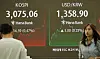 The benchmark Kospi closes at 3,075.06 on July 2, down 0.47 percent from the previous trading day. [YONHAP]