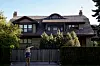 Fans and attendees walk outside the home of Warren Buffett following the Berkshire Hathaway annual shareholder meeting, in Omaha, Nebraska, on May 3. [REUTERS/YONHAP]