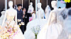 Couples browse wedding dresses at a wedding fair at Coex in Gangnam District, southern Seoul, on July 6. [NEWS1]