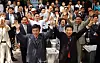 Then liberal presidential candidate Roh Moo-hyun, right, and Seoul mayoral candidate Kim Min-seok cheer at a party rally in Myeong-dong, central Seoul, on May 28, 2002. [YONHAP]