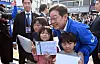 Democratic Party presidential candidate Lee Jae-myung pose for a photograph with children during his campaign in South Gyeongsang on May 14. [KIM SEONG-RYONG]