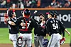 LG Twins players celebrate in the dugout after Moon Bo-gyeong hit an RBI double and took third base against the Hanwha Eagles during Game 4 of the Korean Series at Daejeon Hanwha Life Ballpark in Daejeon on Oct. 30. [NEWS1]