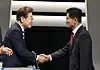 Presidential candidates Lee Jae-myung of the Democratic Party, left, and Kim Moon-soo of the People Power Party shake hands ahead of the second televised debate at KBS headquarters in Yeongdeungpo District, western Seoul, on May 23. [NEWS1]
