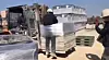 At a factory in Naju, South Jeolla, a case of human rights abuse unfolds as workers tie a migrant laborer to cargo. [JEONNAM MIGRANT WORKERS' HUMAN RIGHTS NETWORK]