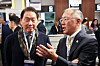 SK Group Chairman Chey Tae-won, left, and Hyundai Motor Group Executive Chair Euisun Chung speak at the 173rd general assembly of the Bureau International des Expositions in France on Tuesday evening. [YONHAP]