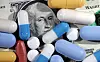 U.S. dollar banknote and medicine are seen in this illustration. [REUTERS/YONHAP]