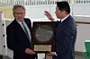 Nvidia CEO Jensen Huang, left, is presented a silicon wafer by SK Group Chairman Chey Tae-won, during the APEC CEO Summit in Gyeongju, Korea, on Oct. 31, 2025. [AP/YONHAP]