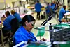 Employees work at NPD Technology, a factory that assembles printed circuit boards for the automotive industry and exports them to the United States, in Ciudad Juarez, Mexico, on Jan. 29. [YONHAP/REUTERS]
