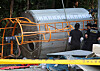 Police forensic investigators examine the scene where workers collapsed and lost consciousness while cleaning a temporary tank at a ready-mix concrete plant in Suncheon, South Jeolla, on Aug. 21. [YONHAP]