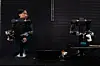 This picture, taken on November 5, 2025, shows Hiro Yamamoto, CEO of the company Enactic, teleoperating an OpenArm humanoid robotic arm at his office during an interview with AFP in Tokyo. A pair of swivelling, human-like robotic arms, built for physical artificial intelligence research, mirror the motions of an operator in a VR headset, twirling his hands like a magician. [AFP/YONHAP]