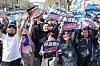 Supporters of Democratic Party leader Rep. Lee Jae-myung celebrate outside the Seoul High Court in Seocho District, southern Seoul, on March 26, after the court acquitted him on all counts of lying during his last presidential campaign. [NEWS1]
