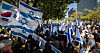 The flags of Israel and Korea held by participants of a rally in Seoul on Tuesday in support of Israel in the wake of the Hamas militant group's attack on Israel and the ongoing war between Israel and Hamas. [NEWS1]
