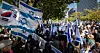 The flags of Israel and Korea held by participants of a rally in Seoul on Tuesday in support of Israel in the wake of the Hamas militant group's attack on Israel and the ongoing war between Israel and Hamas. [NEWS1]
