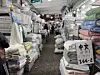 Signs announcing that New Taiwan dollars and U.S. dollars are accepted are put up in the ″blanket alley″ in Gwangjang Market in Jongno District, central Seoul, on Dec. 22. [KWAK JOO-YOUNG]
