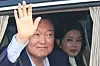 Former President Yoon Suk Yeol and wife Kim Keon Hee wave to supporters as they leave the presidential residence for their private residence on April 11. [JOINT PRESS CORPS]