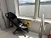 A stroller rests in the wheelchair area on the Hangang Bus on July 1. [CHO JUNG-WOO]