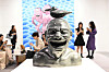 Visitors look at works by Chinese artist Yue Minjun at Art Basel in Hong Kong on March 27, 2024. [YONHAP/AFP]