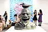 Visitors look at works by Chinese artist Yue Minjun at Art Basel in Hong Kong on March 27, 2024. [YONHAP/AFP]