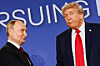 U.S. President Donald Trump, right, stands next to Russian President Vladimir Putin during a press conference in Anchorage, Alaska, on Aug. 15. [REUTERS/YONHAP]