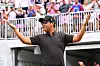 International Team Member Tom Kim asks the crowd for more noise as he arrives on the first tee during the final round singles matches of Presidents Cup at Quail Hollow Sept. 25, 2022, in Charlotte, North Carolina. [GETTY IMAGES]