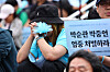 Citizens take part in a rally on June 21, 2025, in front of Seoul Station in central Seoul, to commemorate the death of workers who died due to a fire at the Aricell plant in 2024. [YONHAP]