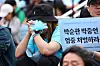 Citizens take part in a rally on June 21, 2025, in front of Seoul Station in central Seoul, to commemorate the death of workers who died due to a fire at the Aricell plant in 2024. [YONHAP]