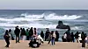 People watch the winter sea in Gangneung, Gangwon, on Tuesday, amid a drastic drop in temperature nationwide. Parts of Gangwon dropped to minus 8.8 degrees, making it the coldest spot in the nation. [YONHAP]