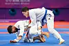 Korean ju-jitsu practitioner Koo Bon-cheol, right, competes in the men's -77 kilograms final against Munfaredi Ali Seena Ebrahim Abdulla of Bahrain at the Hangzhou Asian Games held at Xiaoshan Linpu Gymnasium in Hangzhou, China on Friday. [YONHAP]