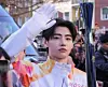 Sunghoon of K-pop group Enhypen holds the Olympic torch for the Milano Cortina Winter Olympics in Milan, Italy, on Feb. 5. [BELIFT LAB]