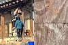 KBS-hired staff are seen putting nails into the walls of Byeongsan Seowon, a Unesco-listed heritage site dating back to 1575 in Andong, North Gyeongsang. [JOONGANG ILBO]